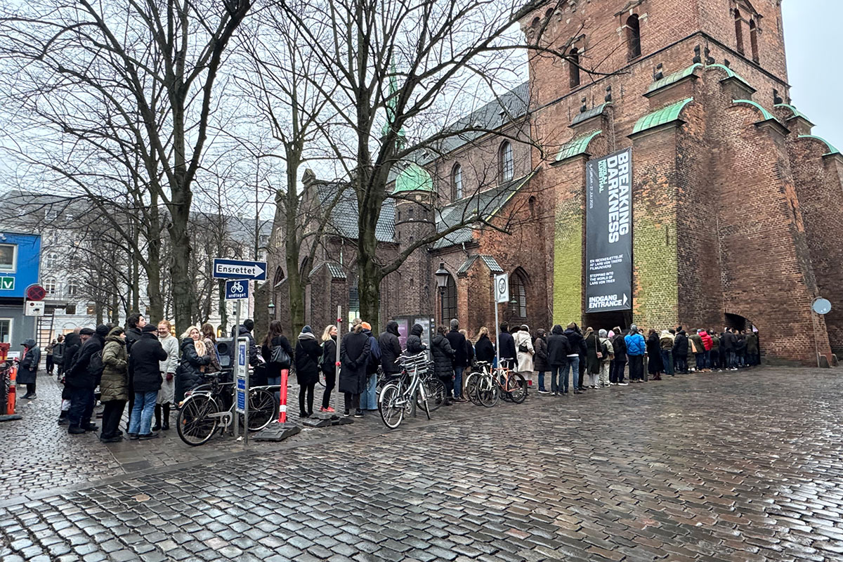 Visitors queuing outside Nikolaj Kunsthal during Breaking Darkness