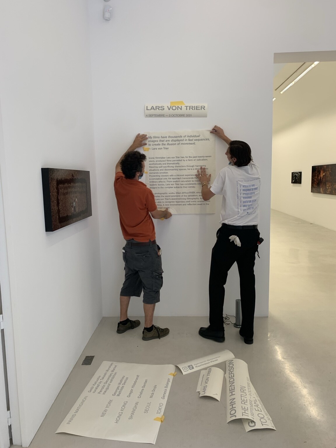 The Lars von Trier exhibition wall text being installed at Perrotin